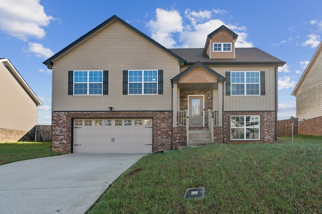 view of front of property featuring a garage and a front lawn