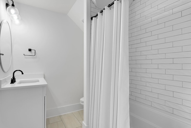 full bathroom featuring vanity, toilet, and shower / bath combo with shower curtain