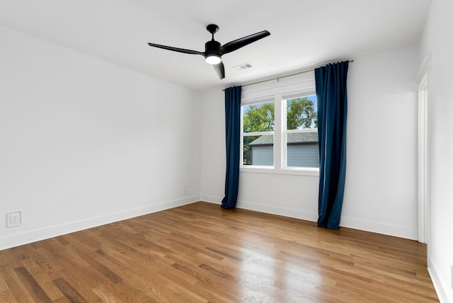 unfurnished room featuring hardwood / wood-style flooring and ceiling fan