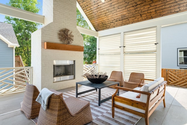 view of patio / terrace featuring an outdoor brick fireplace