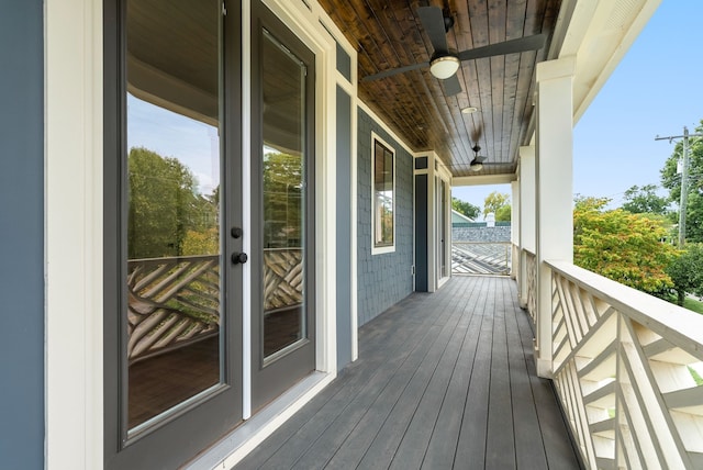 wooden terrace featuring ceiling fan and covered porch