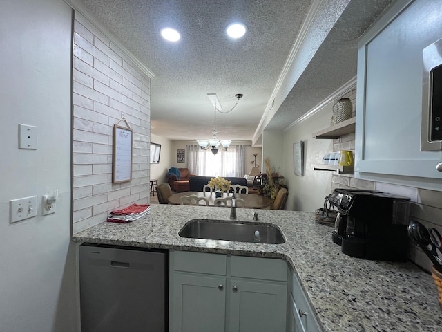 kitchen with a chandelier, dishwasher, crown molding, and a textured ceiling