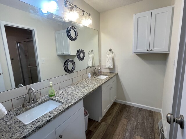 bathroom featuring vanity and hardwood / wood-style flooring