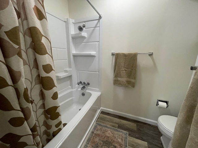 bathroom featuring hardwood / wood-style floors, toilet, and shower / bath combo