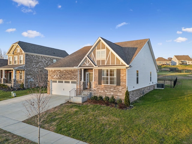 view of front of house with a garage and a front lawn