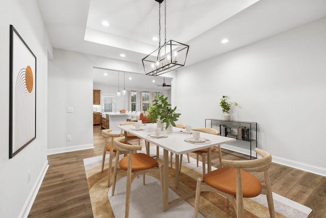 dining area with dark hardwood / wood-style flooring