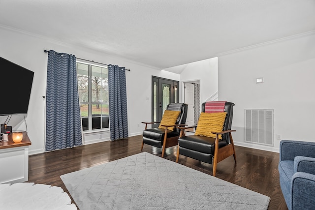 living room with crown molding and dark hardwood / wood-style floors