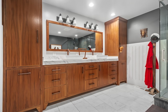 bathroom with vanity and walk in shower