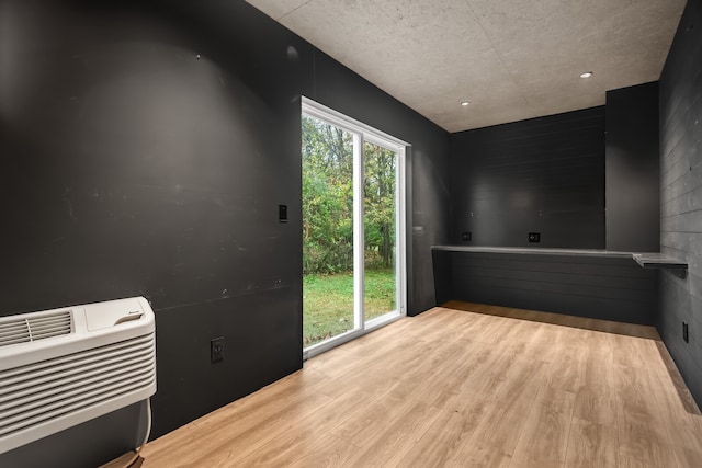 interior space with heating unit and light hardwood / wood-style floors