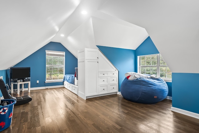 bedroom with dark wood-type flooring and vaulted ceiling