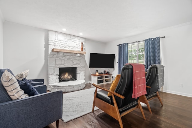 living room featuring a fireplace and hardwood / wood-style floors