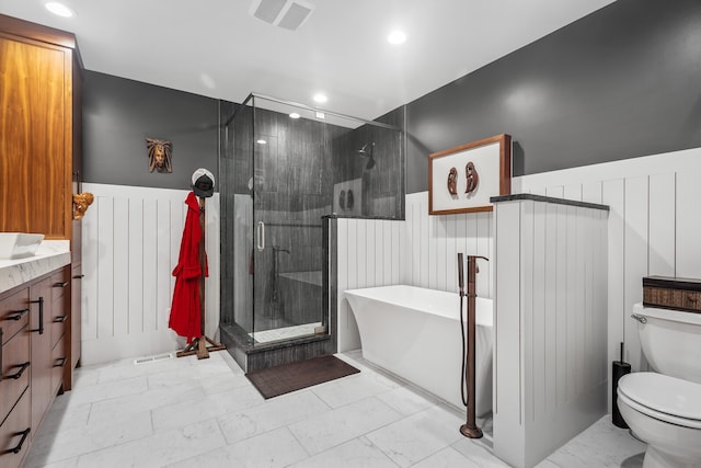 full bathroom with shower with separate bathtub, vanity, and toilet