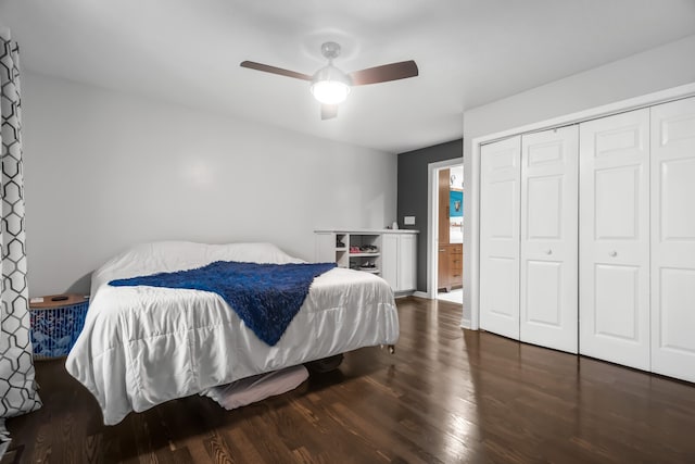 bedroom with a closet, dark hardwood / wood-style floors, and ceiling fan