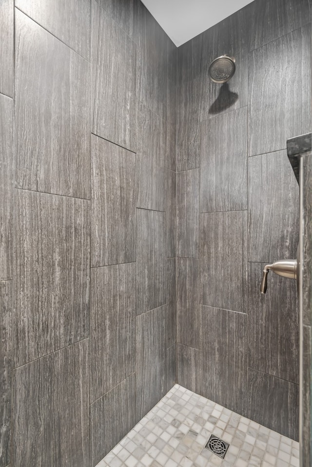 bathroom with tiled shower