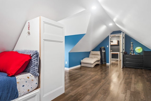 bedroom featuring dark wood-type flooring and lofted ceiling