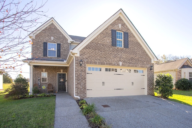 front facade with a front yard and a garage