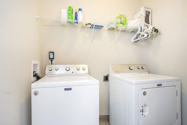 washroom with washing machine and dryer