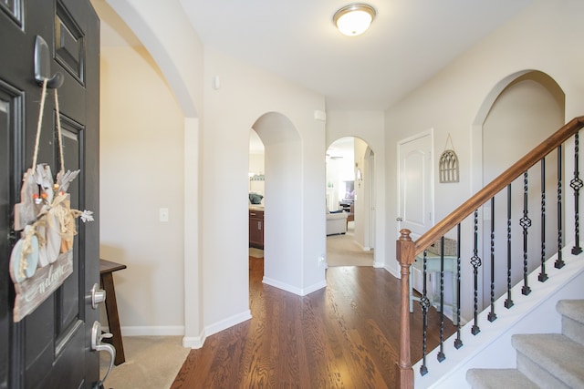 foyer entrance with dark hardwood / wood-style flooring