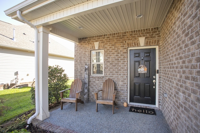 entrance to property featuring a porch