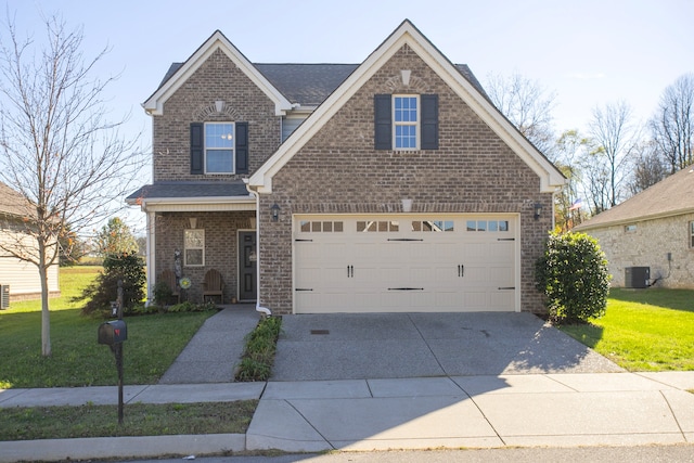 view of front of house featuring a garage, a front lawn, and central air condition unit