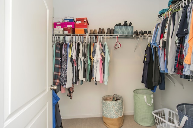 spacious closet with carpet flooring