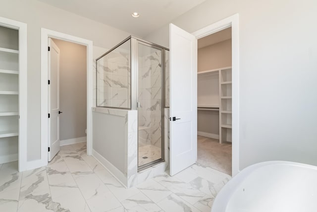 132 Aarons Cress Blvd, Hermitage, TN 37076 - full bathroom with a spacious closet, a stall shower, recessed lighting, and marble look tile flooring