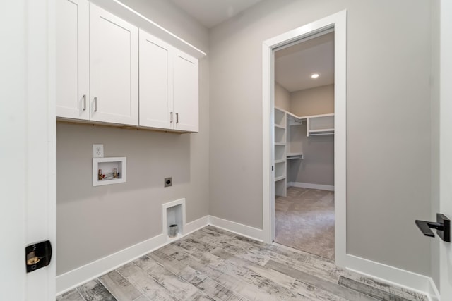 132 Aarons Cress Blvd, Hermitage, TN 37076 - laundry room with cabinet space, hookup for an electric dryer, hookup for a washing machine, and light wood-style flooring