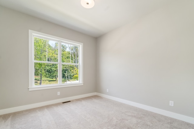 spare room featuring carpet