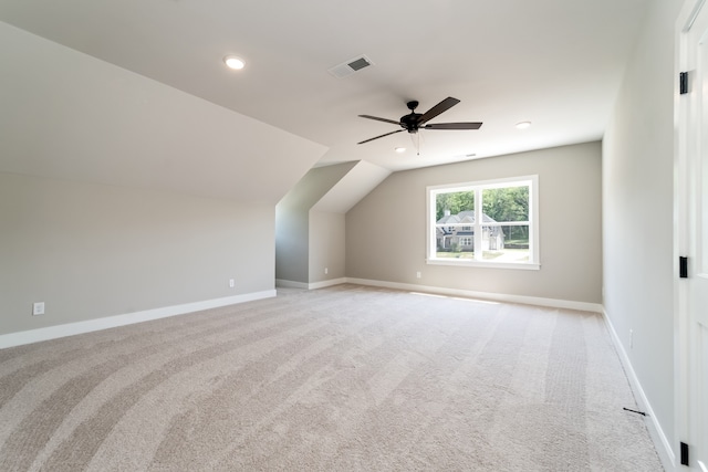 bonus room featuring vaulted ceiling, ceiling fan, and light carpet