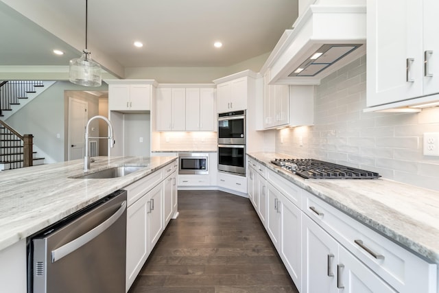132 Aarons Cress Blvd, Hermitage, TN 37076 - kitchen with stainless steel appliances, premium range hood, white cabinetry, dark wood-style flooring, and recessed lighting