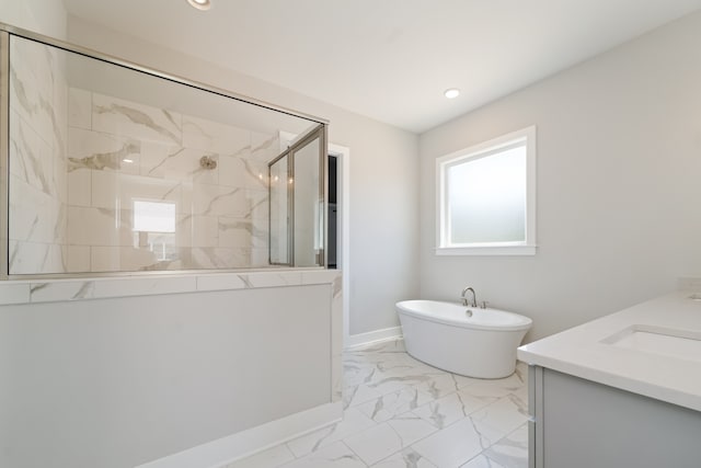 bathroom with shower with separate bathtub and vanity