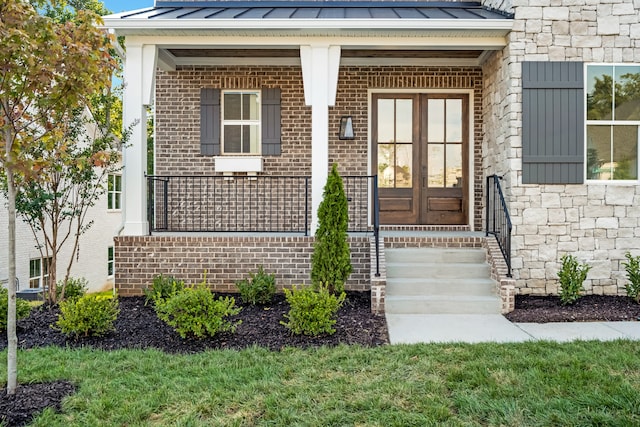 doorway to property featuring a porch