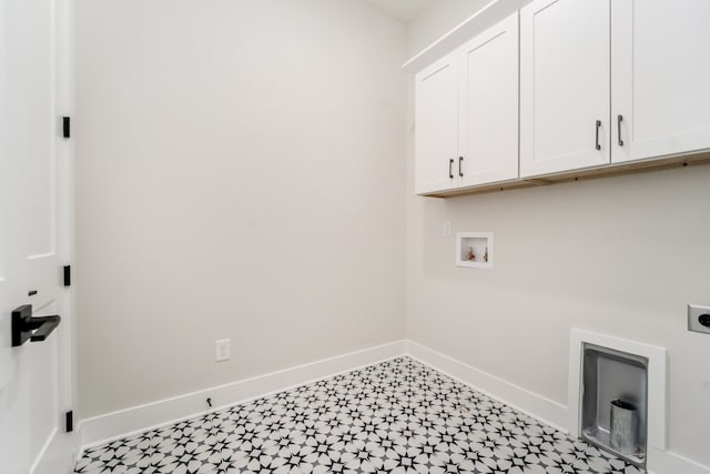 clothes washing area featuring electric dryer hookup, cabinets, and hookup for a washing machine