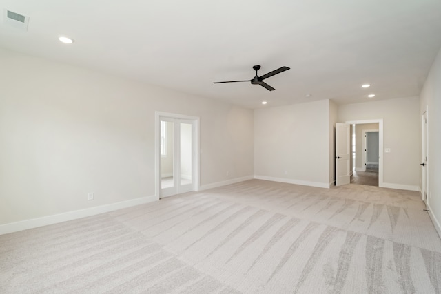 empty room with light carpet and ceiling fan