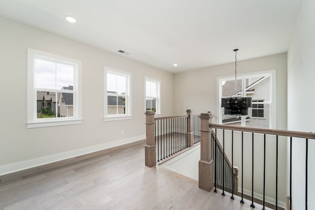 corridor featuring light hardwood / wood-style flooring