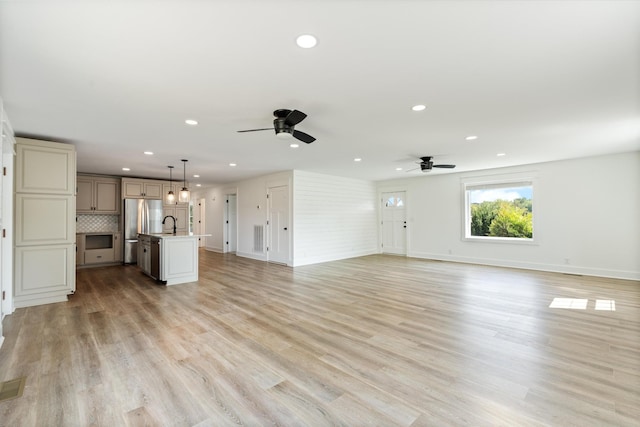 2105 52e Hwy, Portland, TN 37148 - unfurnished living room with ceiling fan, recessed lighting, baseboards, and light wood-style flooring