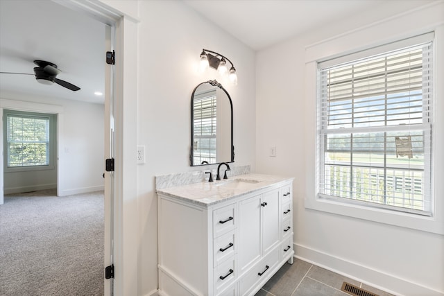 bathroom featuring vanity, ceiling fan, and tile patterned floors