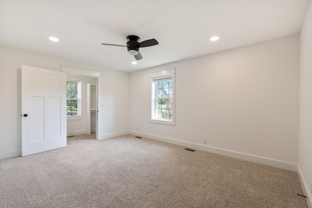 carpeted empty room with ceiling fan