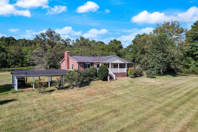 2105 52e Hwy, Portland, TN 37148 - ranch-style house featuring a chimney, a front yard, brick siding, and a forest view