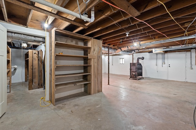 basement featuring a wood stove