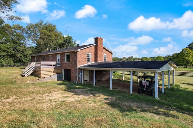 rear view of property with a yard