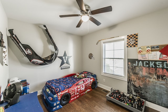 bedroom featuring ceiling fan and dark wood-type flooring