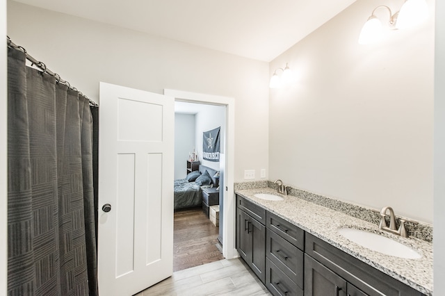 bathroom with vanity and hardwood / wood-style flooring