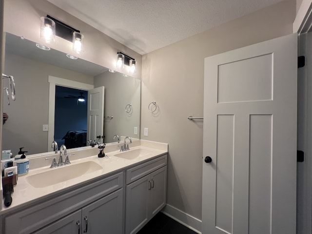 bathroom featuring vanity and a textured ceiling