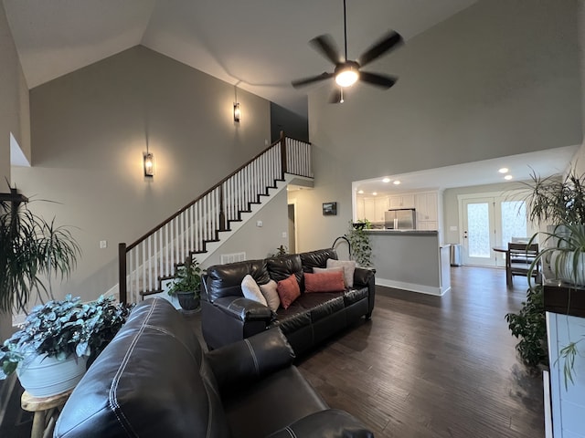 living room featuring ceiling fan, high vaulted ceiling, and dark wood-type flooring