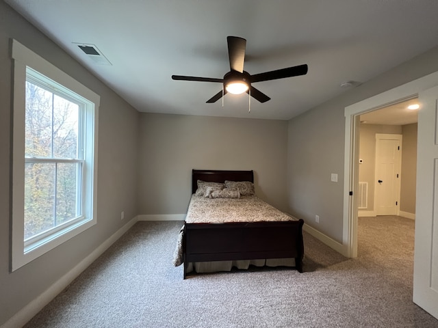 carpeted bedroom with ceiling fan