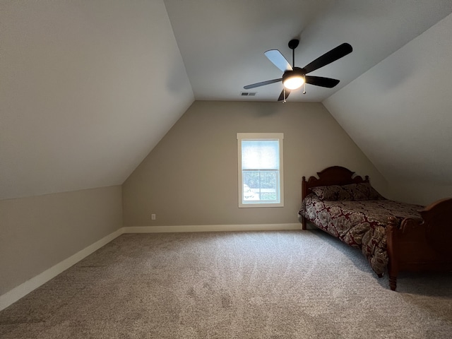 carpeted bedroom featuring ceiling fan and vaulted ceiling