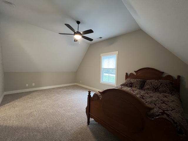 carpeted bedroom with ceiling fan and lofted ceiling