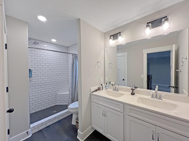 731 Hogan Rd, Clarksville, TN 37043 - full bathroom with a tile shower, double vanity, toilet, wood finished floors, and recessed lighting