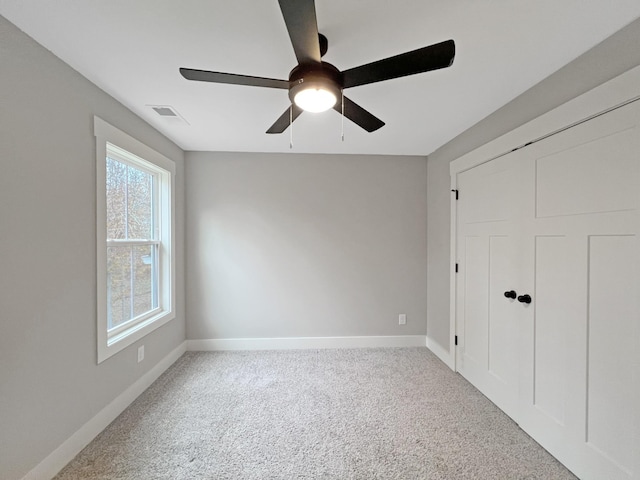 731 Hogan Rd, Clarksville, TN 37043 - unfurnished bedroom with carpet floors, baseboards, a ceiling fan, and a closet